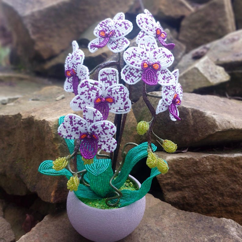 Orchidée topiaire artificielle perlée en pot